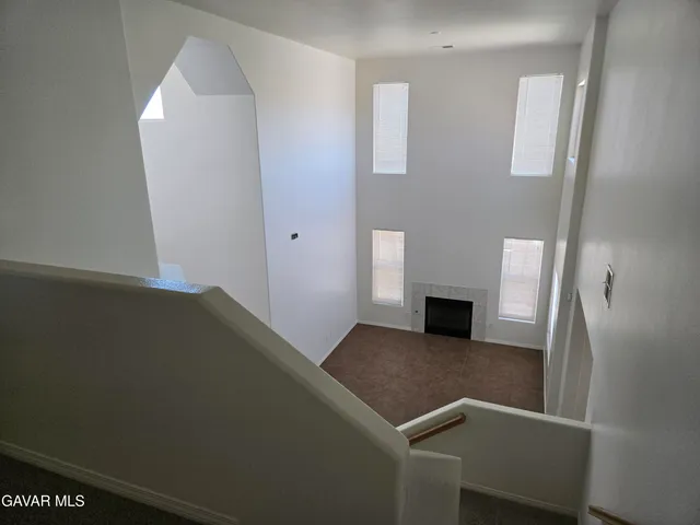 an empty room with a fireplace