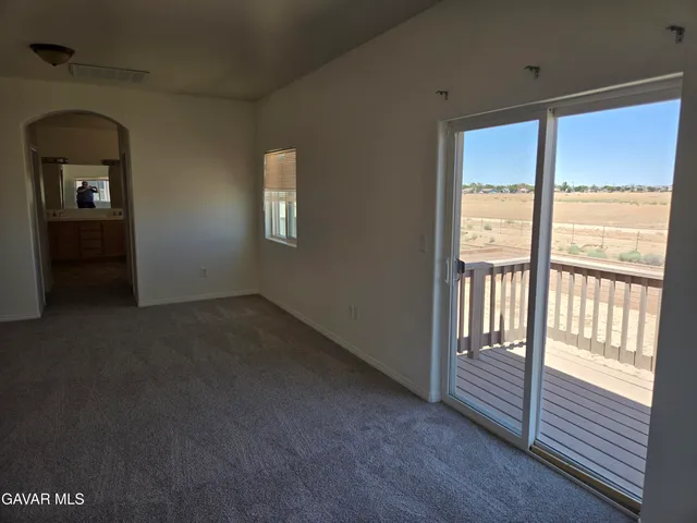 a bathroom with a bathtub sink vanity and mirror