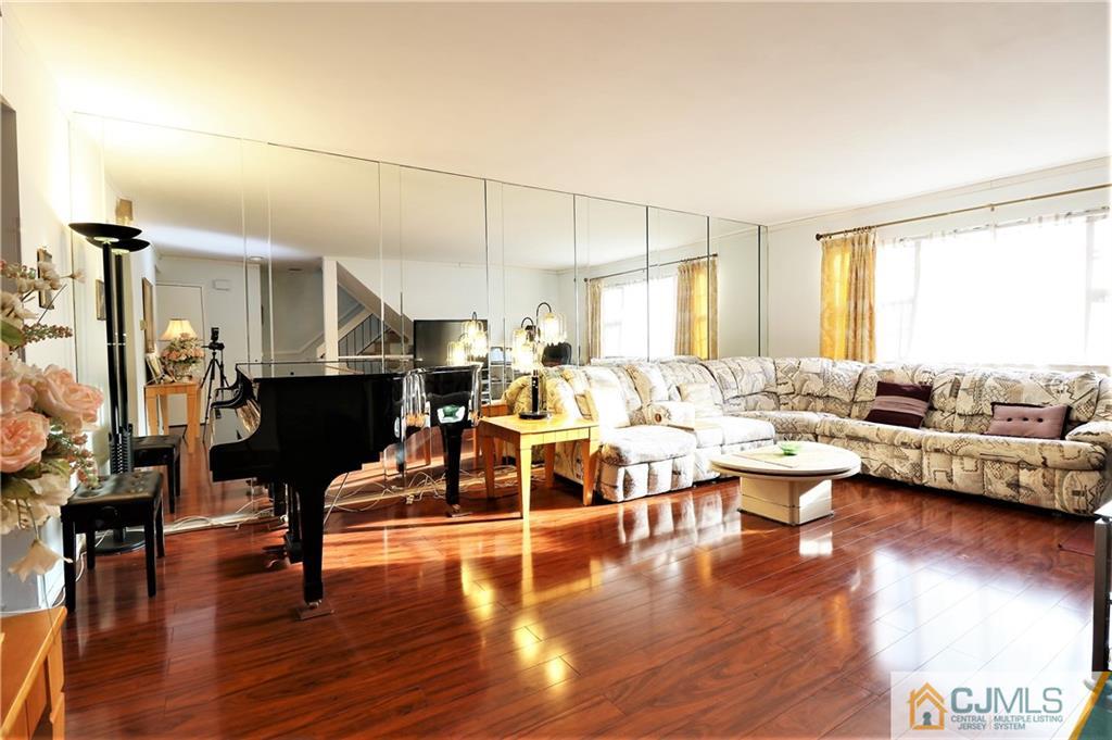 6801 Hana Road Edison, NJ 08817 - Photo 4 of 24 a living room with furniture window and wooden floor