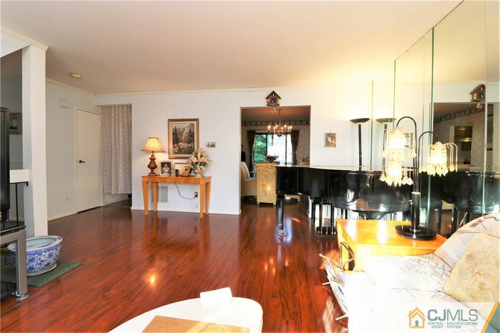 6801 Hana Road Edison, NJ 08817 - Photo 5 of 24 a living room with fireplace furniture and a wooden floor
