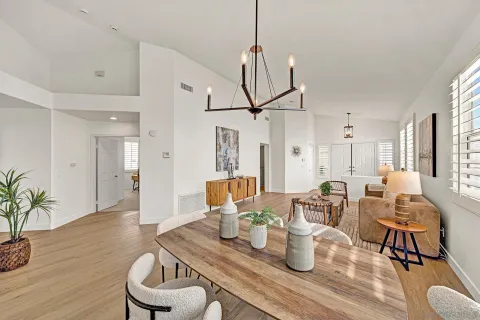a living room with lots of furniture and a wooden floor
