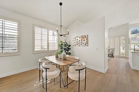 a view of a dining room with furniture window and wooden floor