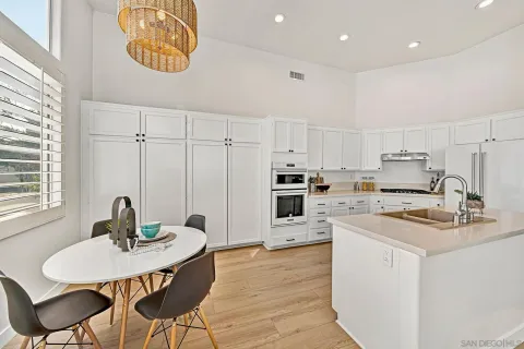 a dining room with furniture and wooden floor
