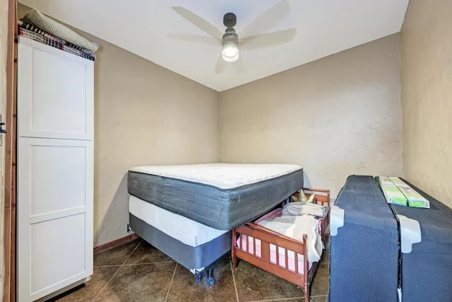a living room with chairs and a table