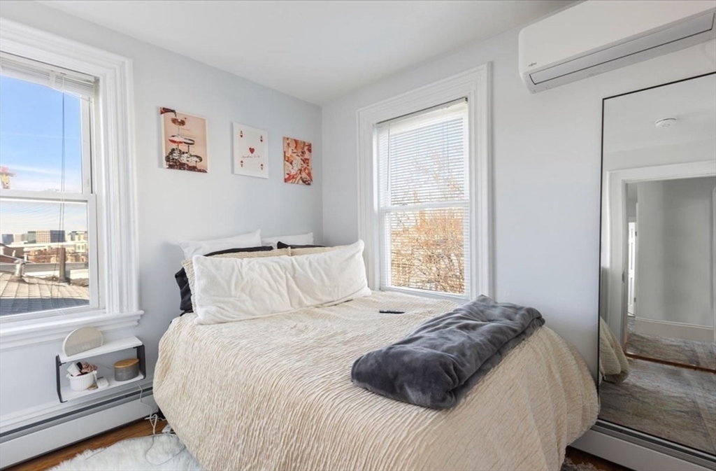 16 Atlantic Street Boston, MA 02127 - Photo 15 of 18 a bedroom with a bed and a window