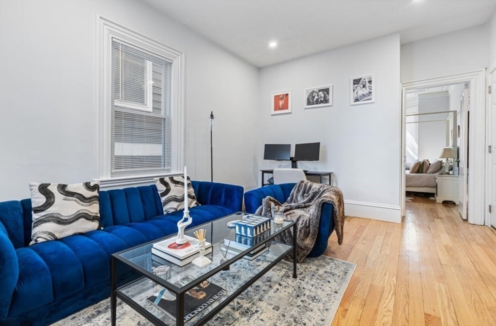 16 Atlantic Street Boston, MA 02127 - Photo 2 of 18 a living room with furniture and a wooden floor