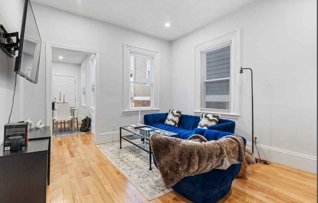 16 Atlantic Street Boston, MA 02127 - Photo 3 of 18 a bed room with a bed and a couch