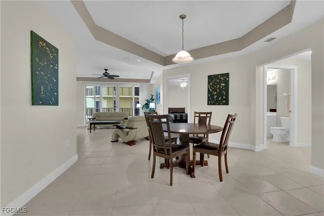 a view of a dining room with furniture and window