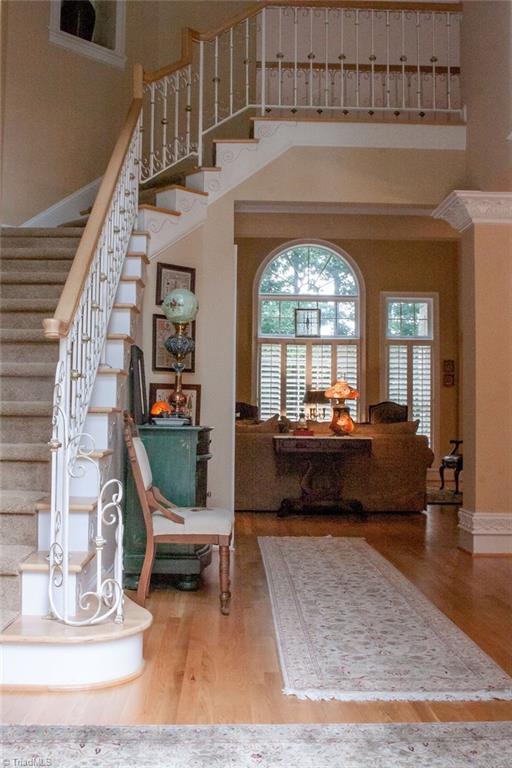 4109 Rockingham Road South Greensboro, NC 27407 - Photo 3 of 27 Entrance hall. Wrought iron detailing on stairway is both beautiful and functional.