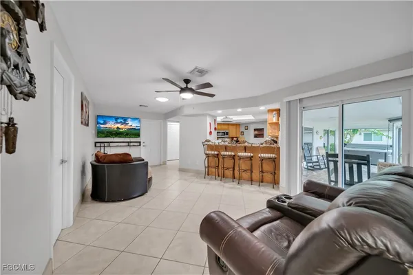 a living room filled with furniture and furniture