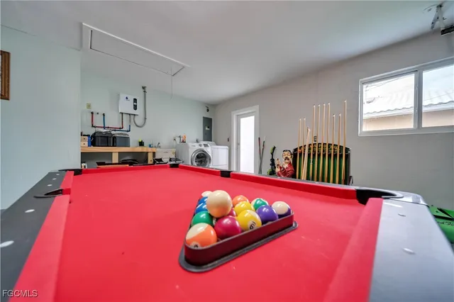 a bedroom with furniture and a pool