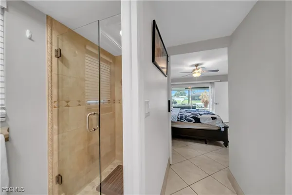 a en suite bathroom with a sink and a mirror