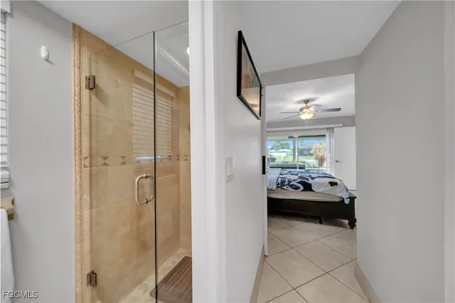 a en suite bathroom with a sink and a mirror