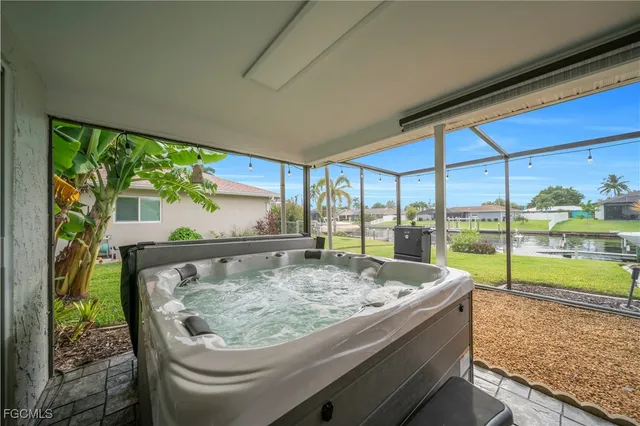 a bed sitting in a balcony next to a yard
