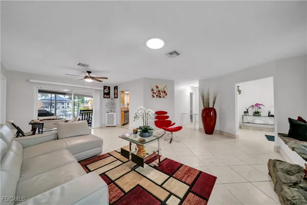 a living room with furniture and a window