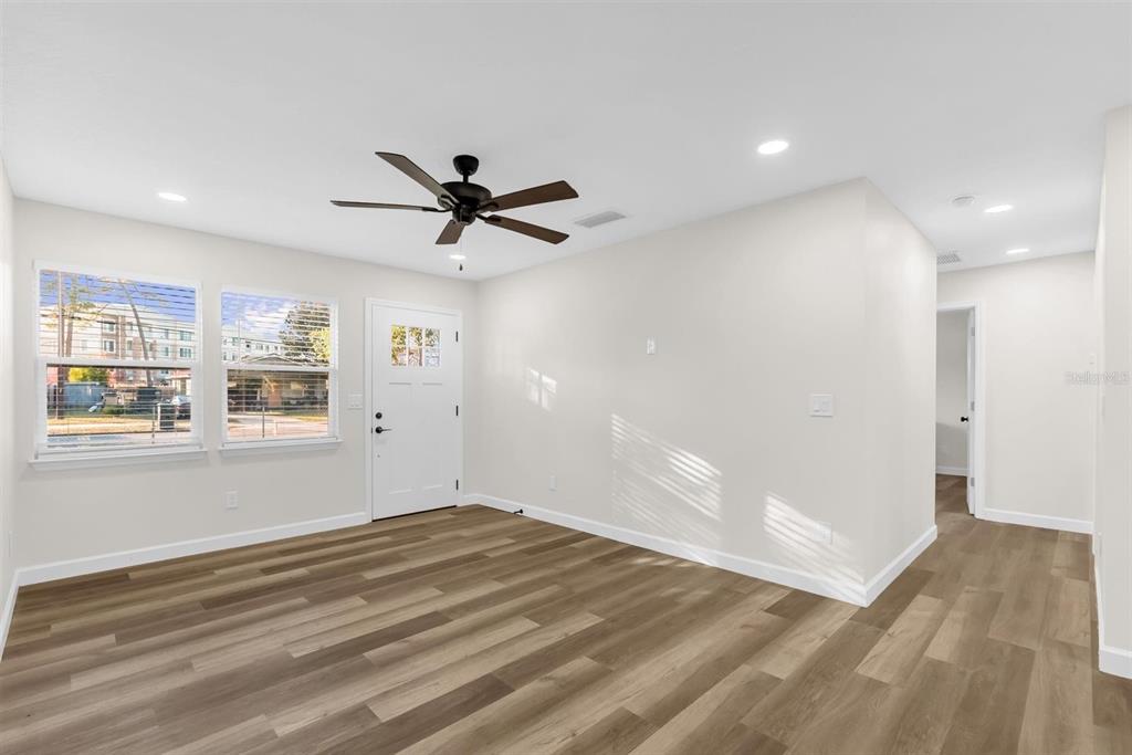1507 Constantine Street Orlando, FL 32825 - Photo 7 of 27 a view of a big room with wooden floor and windows