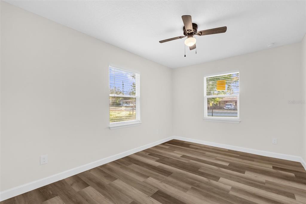 1507 Constantine Street Orlando, FL 32825 - Photo 8 of 27 a view of empty room with wooden floor and fan