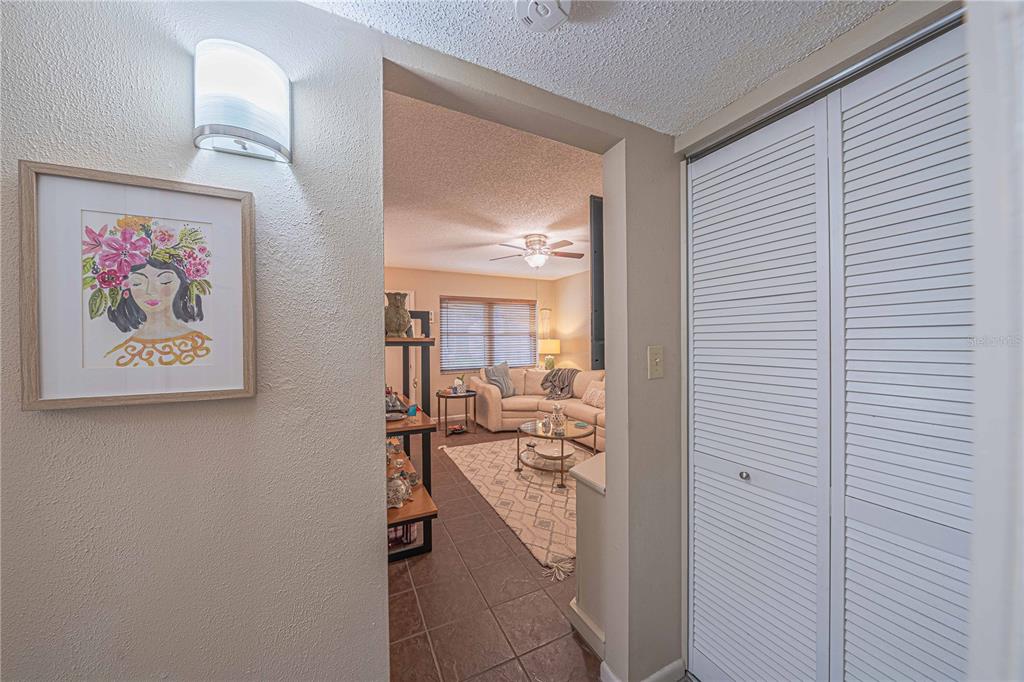 2418 Northeast 7th Street, Unit 6 Ocala, FL 34470 - Photo 13 of 33 a view of a hallway with a workspace