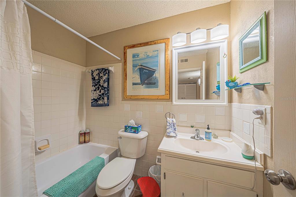 2418 Northeast 7th Street, Unit 6 Ocala, FL 34470 - Photo 20 of 39 a bathroom with a sink mirror vanity and toilet