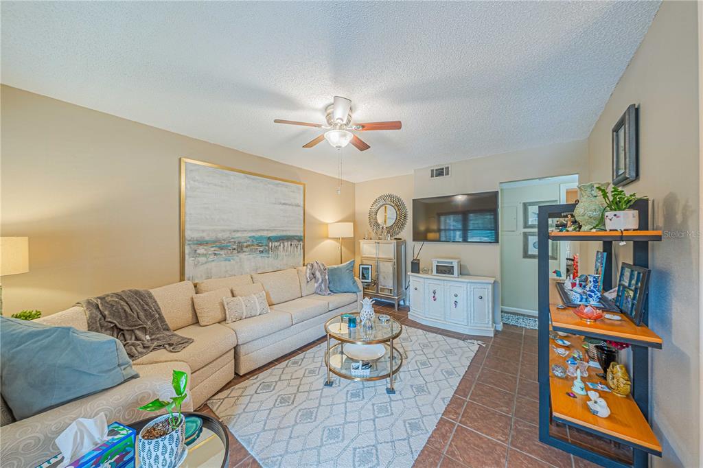2418 Northeast 7th Street, Unit 6 Ocala, FL 34470 - Photo 2 of 33 a living room with furniture and wooden floor