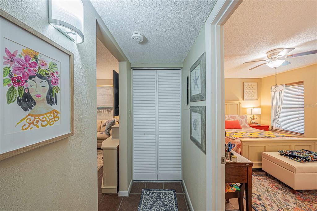 2418 Northeast 7th Street, Unit 6 Ocala, FL 34470 - Photo 26 of 39 walk in closet with window and a kitchen view