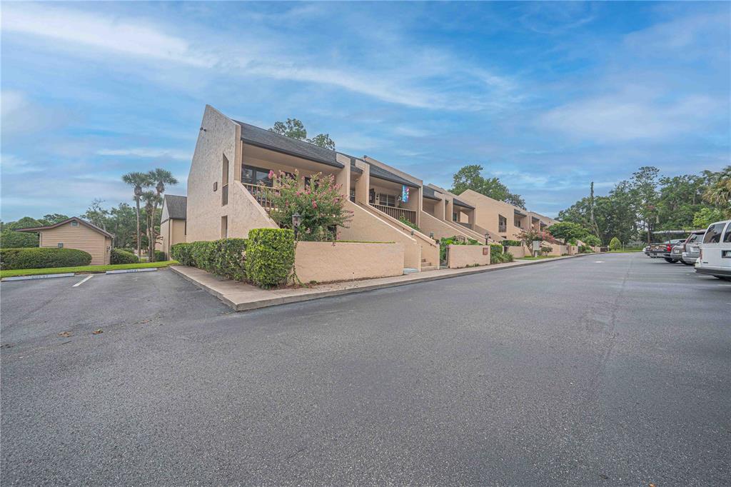 2418 Northeast 7th Street, Unit 6 Ocala, FL 34470 - Photo 28 of 39 a view of a street with a houses