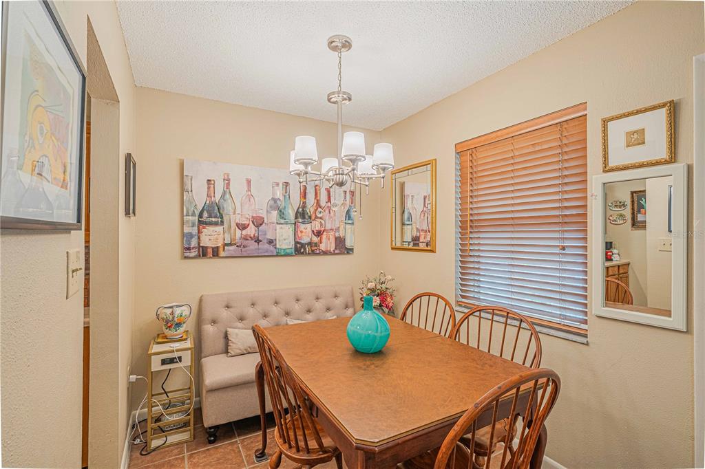 2418 Northeast 7th Street, Unit 6 Ocala, FL 34470 - Photo 7 of 33 a view of a dining room with furniture and window
