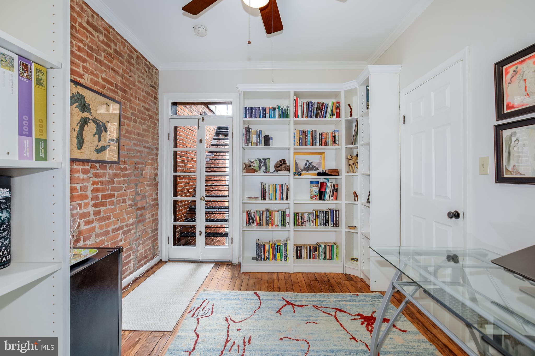 804 A Street Northeast Washington, DC 20002 - Photo 15 of 25 a room with furniture and a book shelf