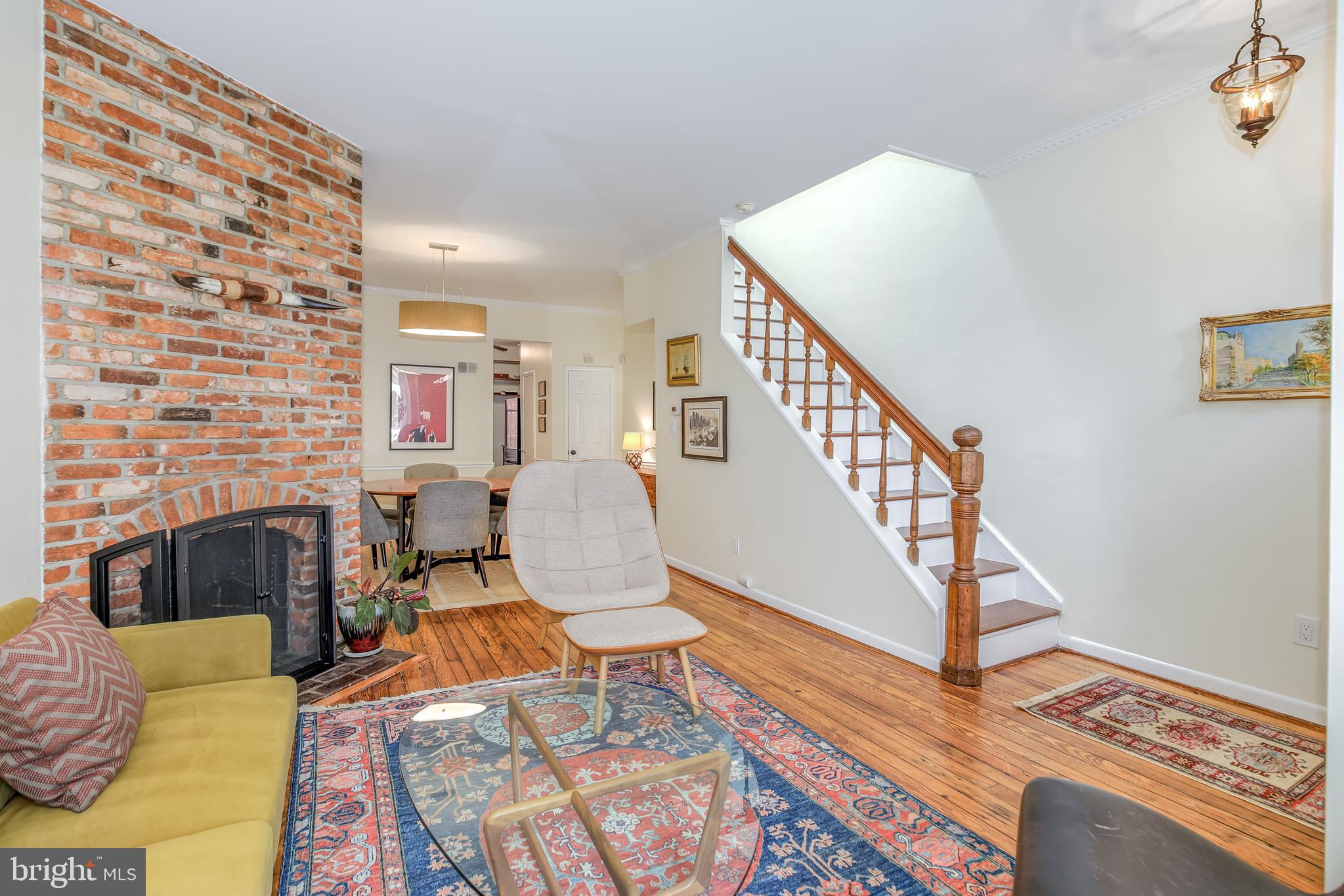 804 A Street Northeast Washington, DC 20002 - Photo 3 of 25 a living room with furniture and a fireplace