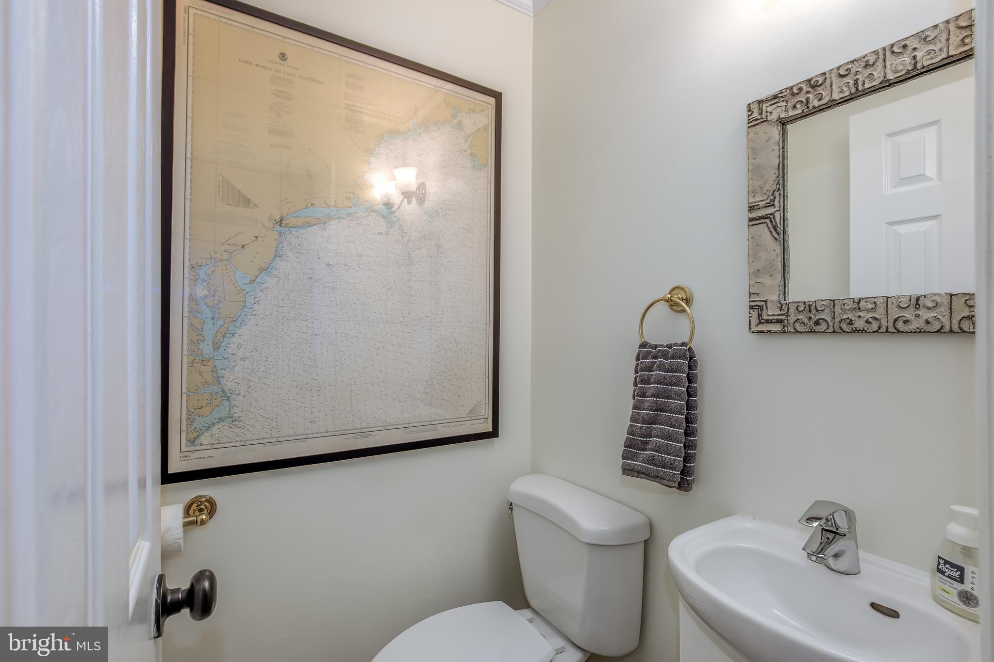804 A Street Northeast Washington, DC 20002 - Photo 6 of 25 a bathroom with a toilet sink and mirror