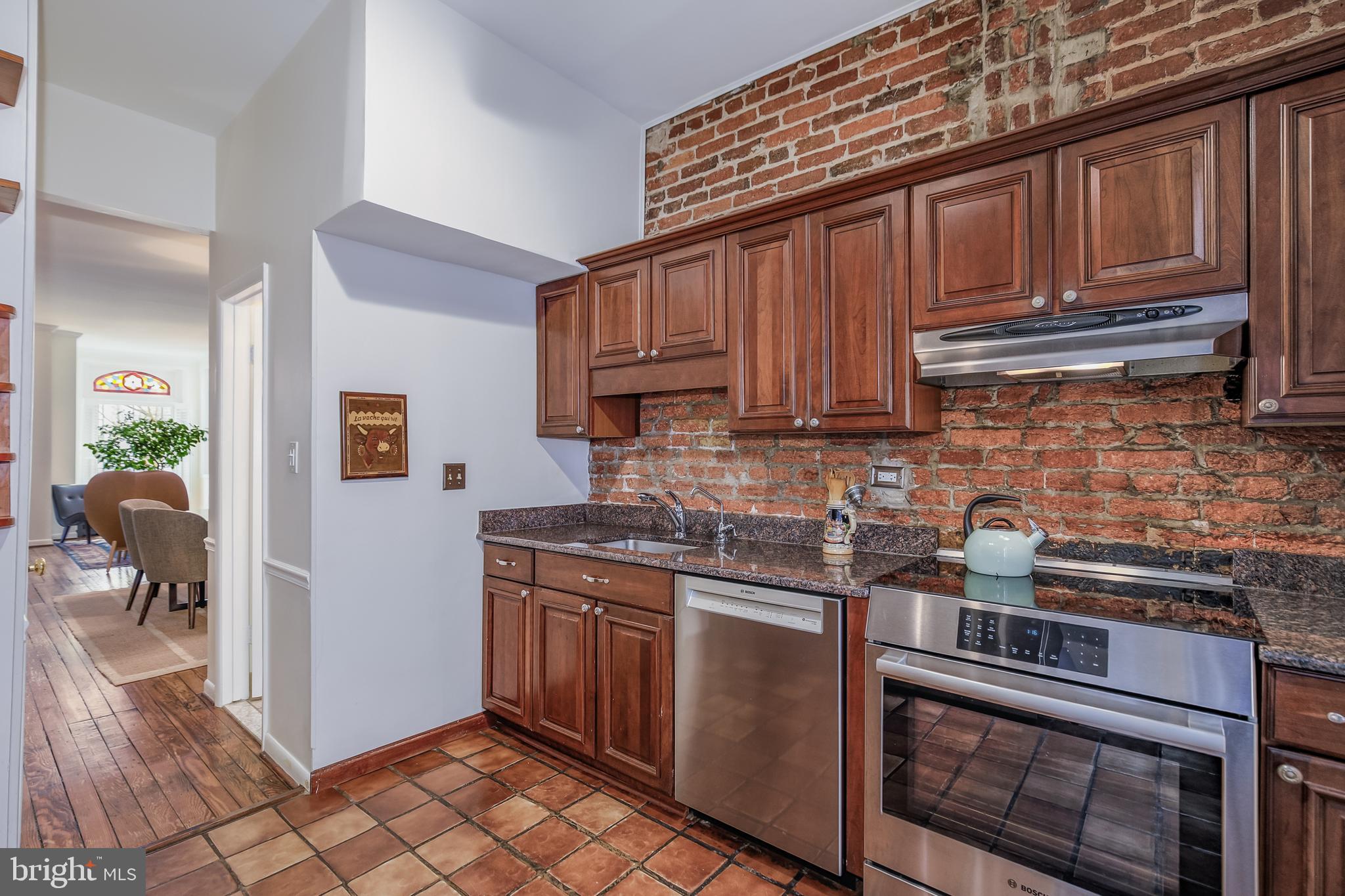 804 A Street Northeast Washington, DC 20002 - Photo 7 of 25 a kitchen with stainless steel appliances granite countertop a sink stove and cabinets