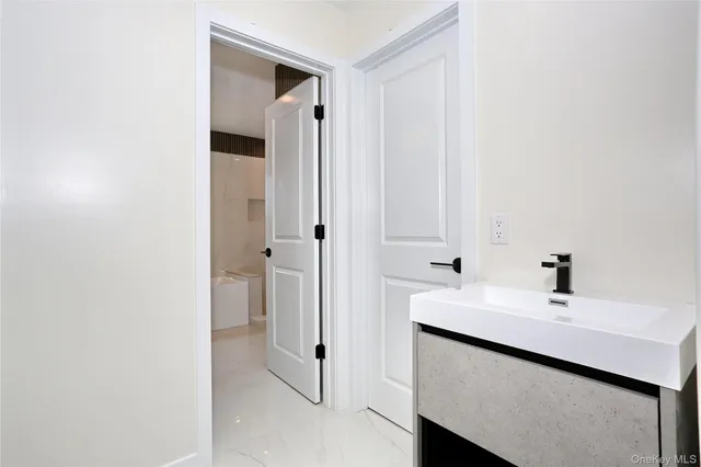 a bathroom with a sink and a mirror