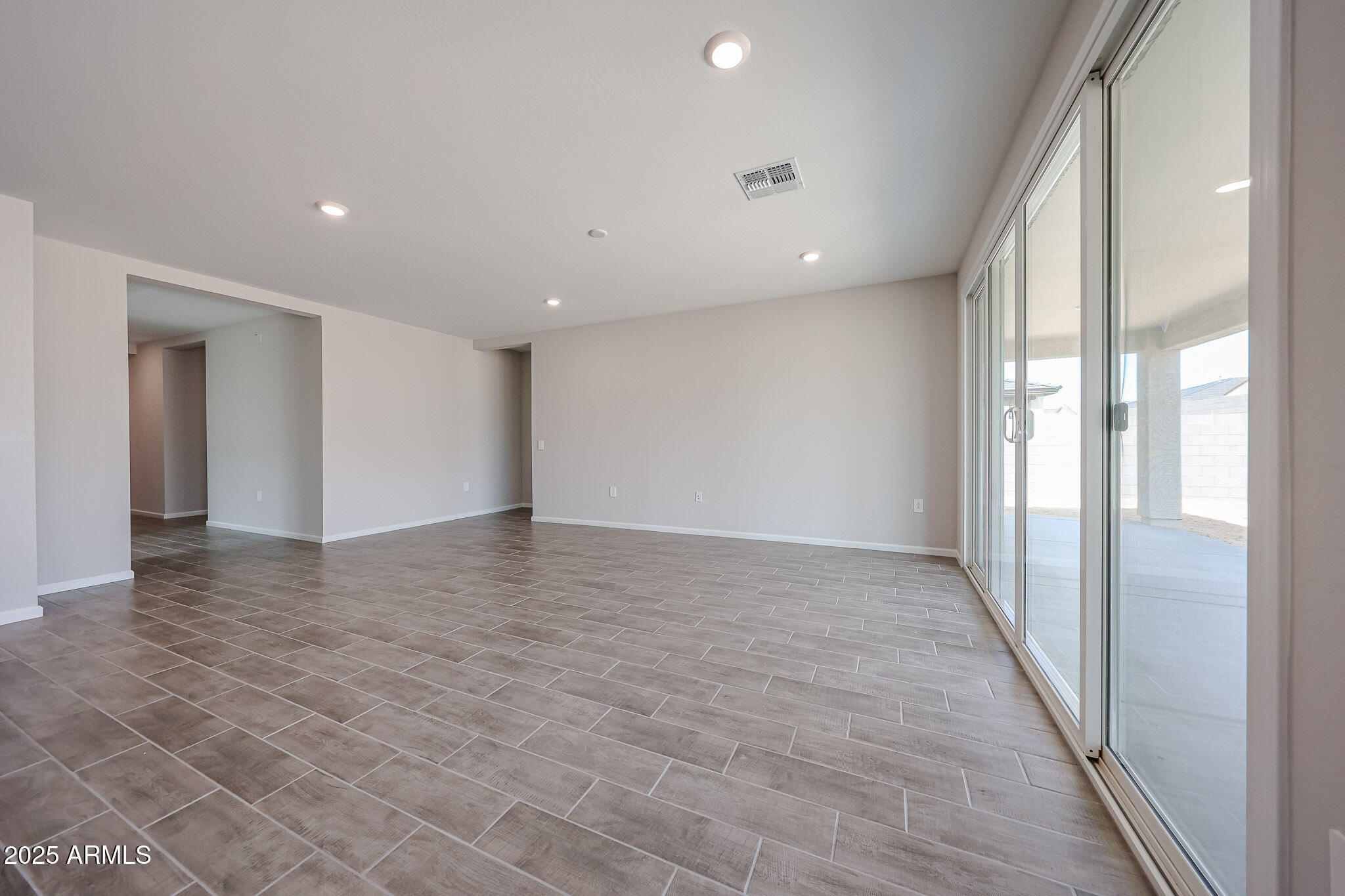 17867 West Fulton Street Goodyear, AZ 85338 - Photo 11 of 40 a view of hallway with a large window