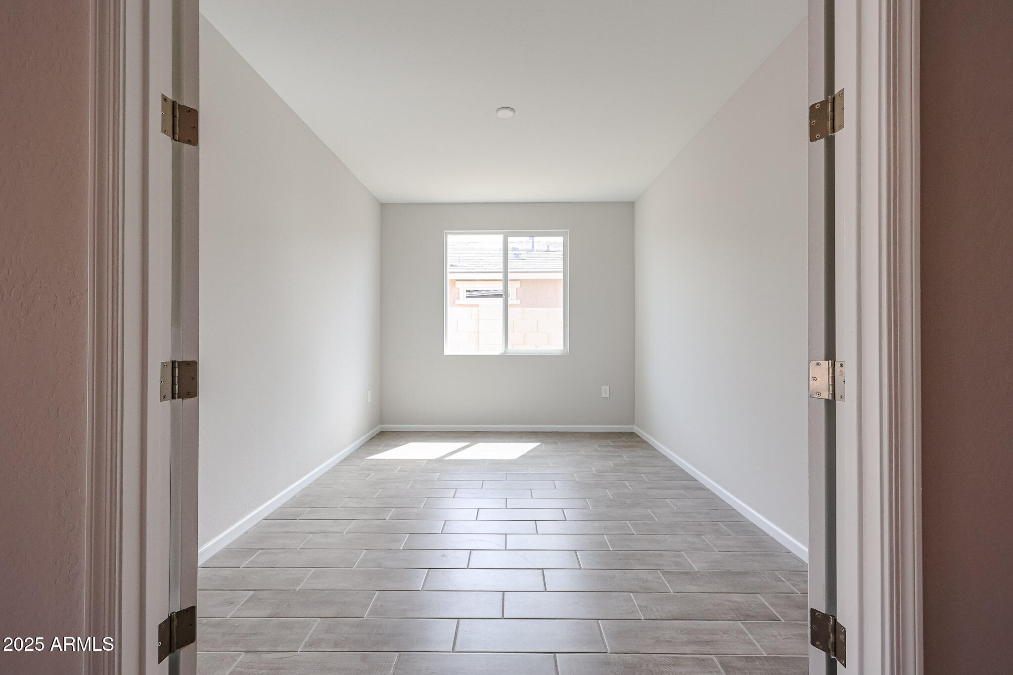 17867 West Fulton Street Goodyear, AZ 85338 - Photo 24 of 40 a view of an empty room and window