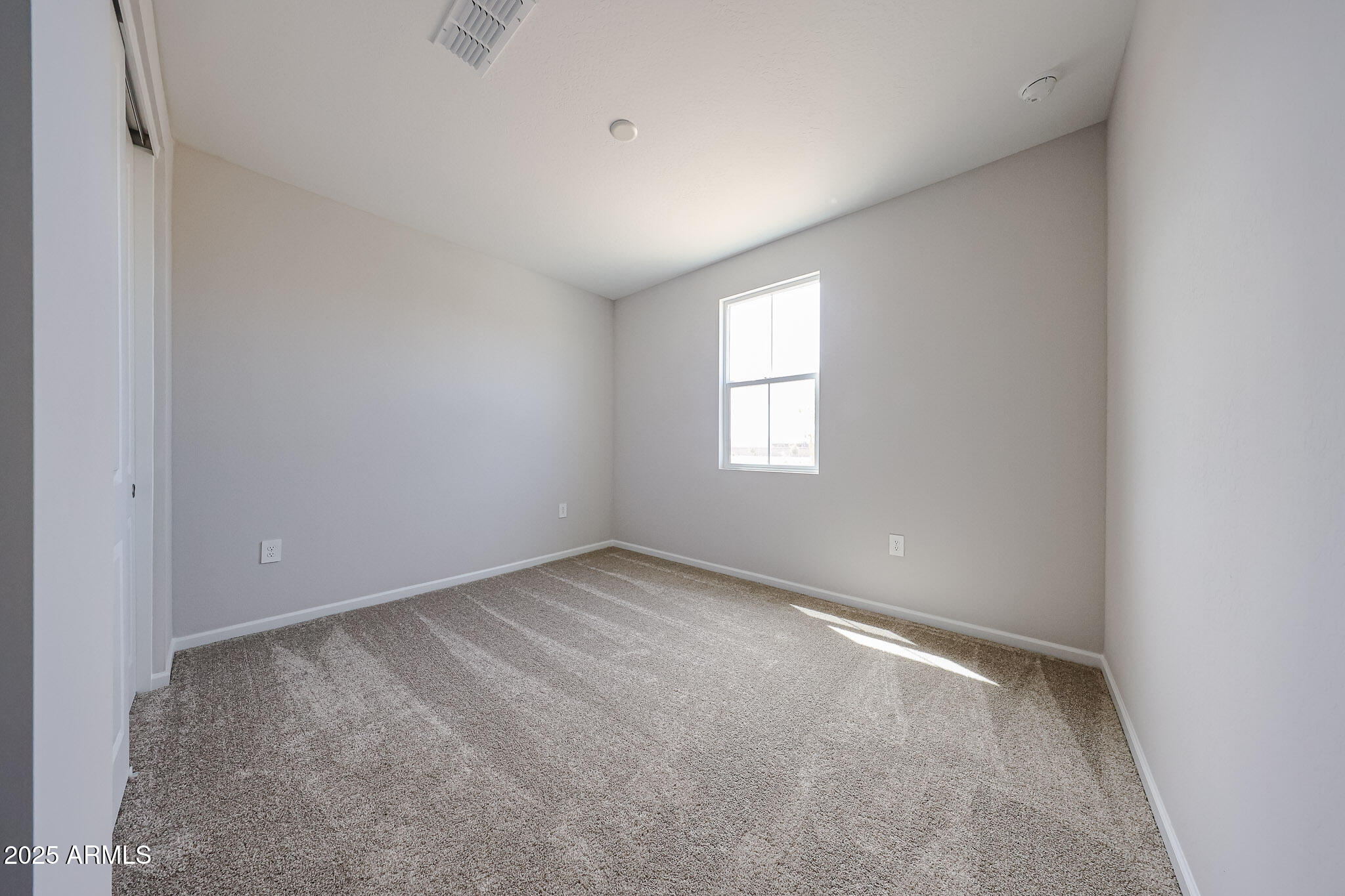 17867 West Fulton Street Goodyear, AZ 85338 - Photo 35 of 40 an empty room with windows