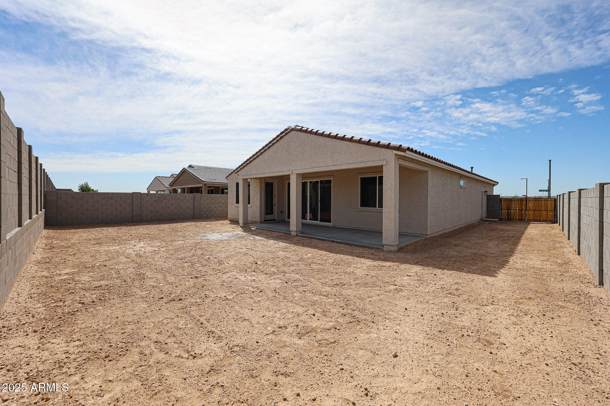 17867 West Fulton Street Goodyear, AZ 85338 - Photo 36 of 40 a house with trees in the background