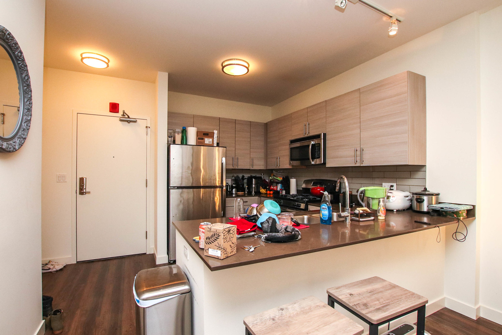 1164 West Madison Street, Unit 309 Chicago, IL 60607 - Photo 5 of 18 a living room with furniture and a flat screen tv