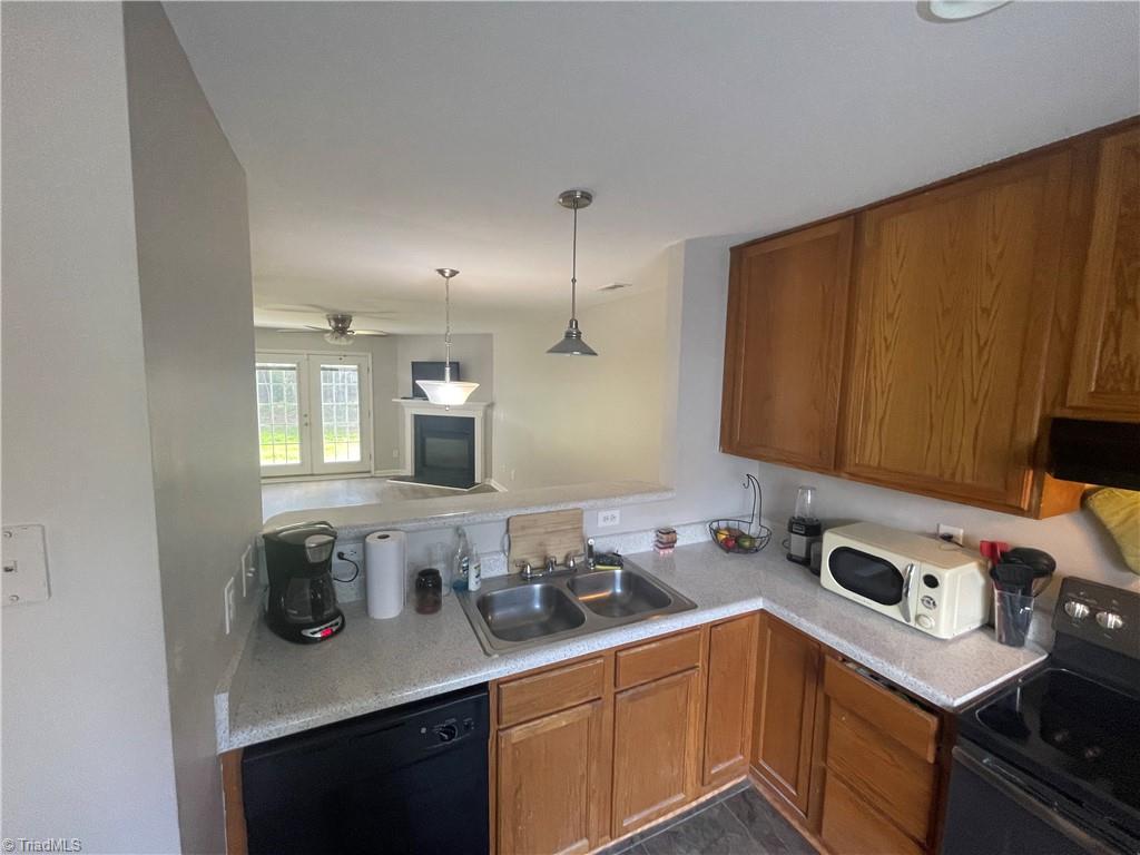 2229 Walnut Ridge Court Raleigh, NC 27610 - Photo 11 of 12 Nicely appointed kitchen overlooks the spacious living area