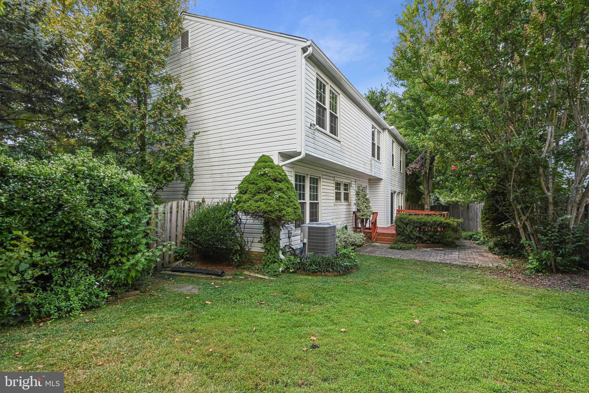 13345 Point Rider Lane Herndon, VA 20171 - Photo 42 of 43 a view of a house with backyard and sitting area