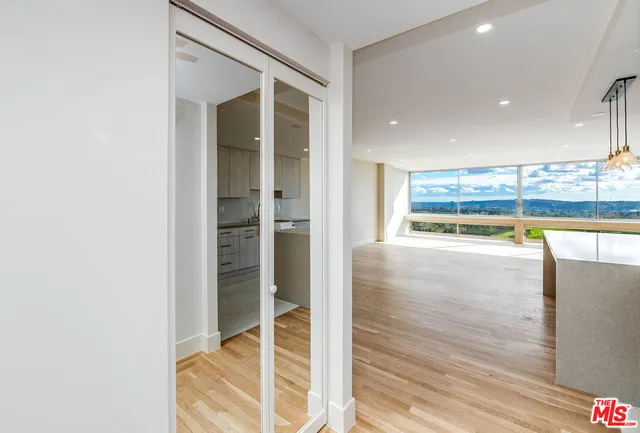 a view of room with wooden floor