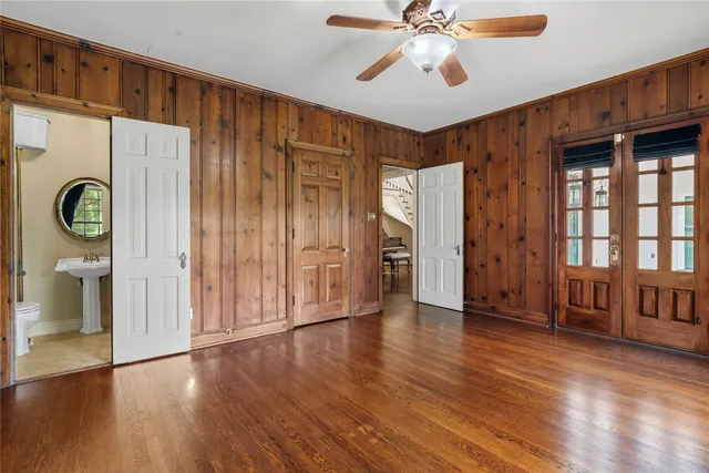 a view of an entryway with wooden floor