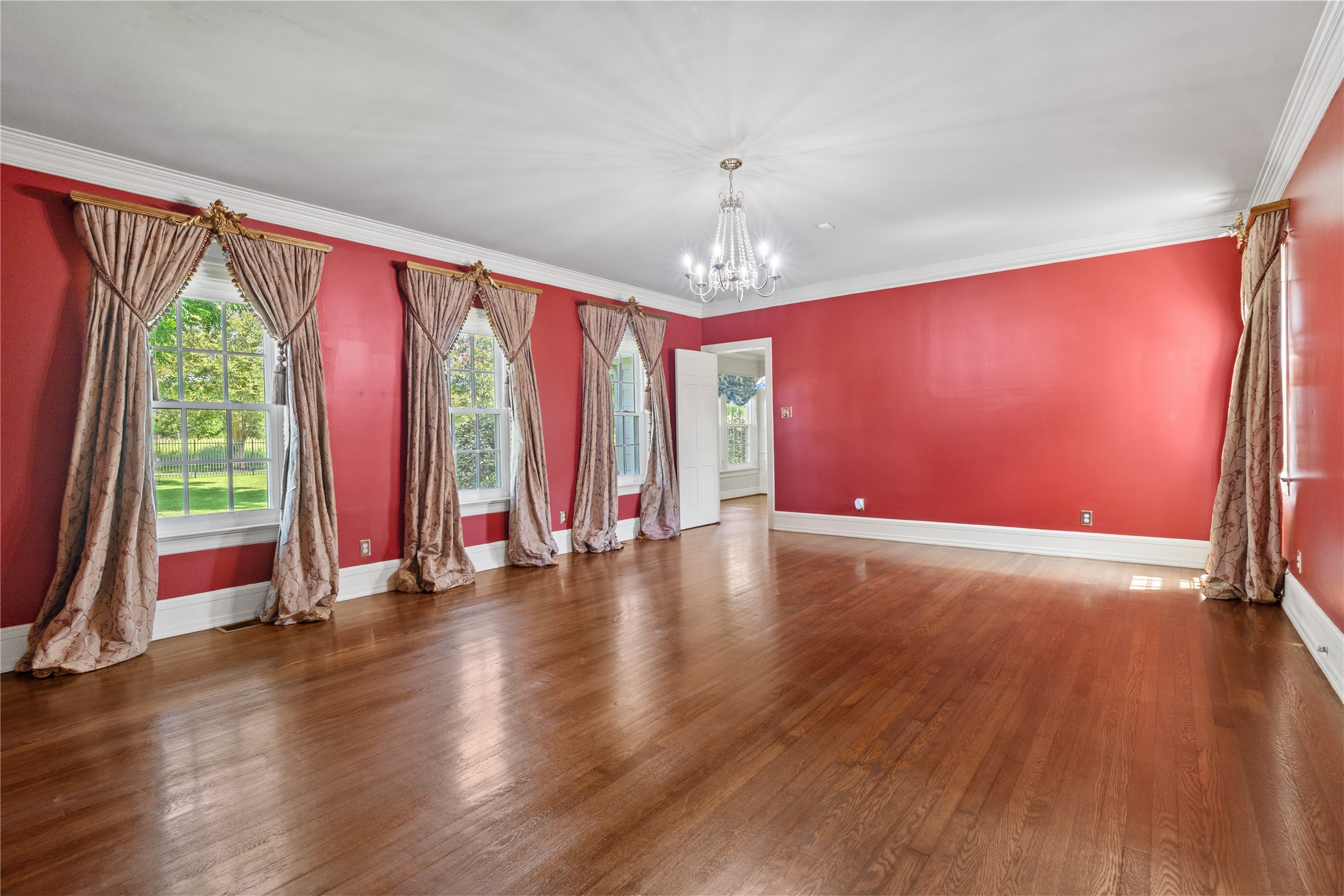 9827 FM 2759 Road Richmond, TX 77469 - Photo 13 of 50 a view of an empty room with wooden floor and a window