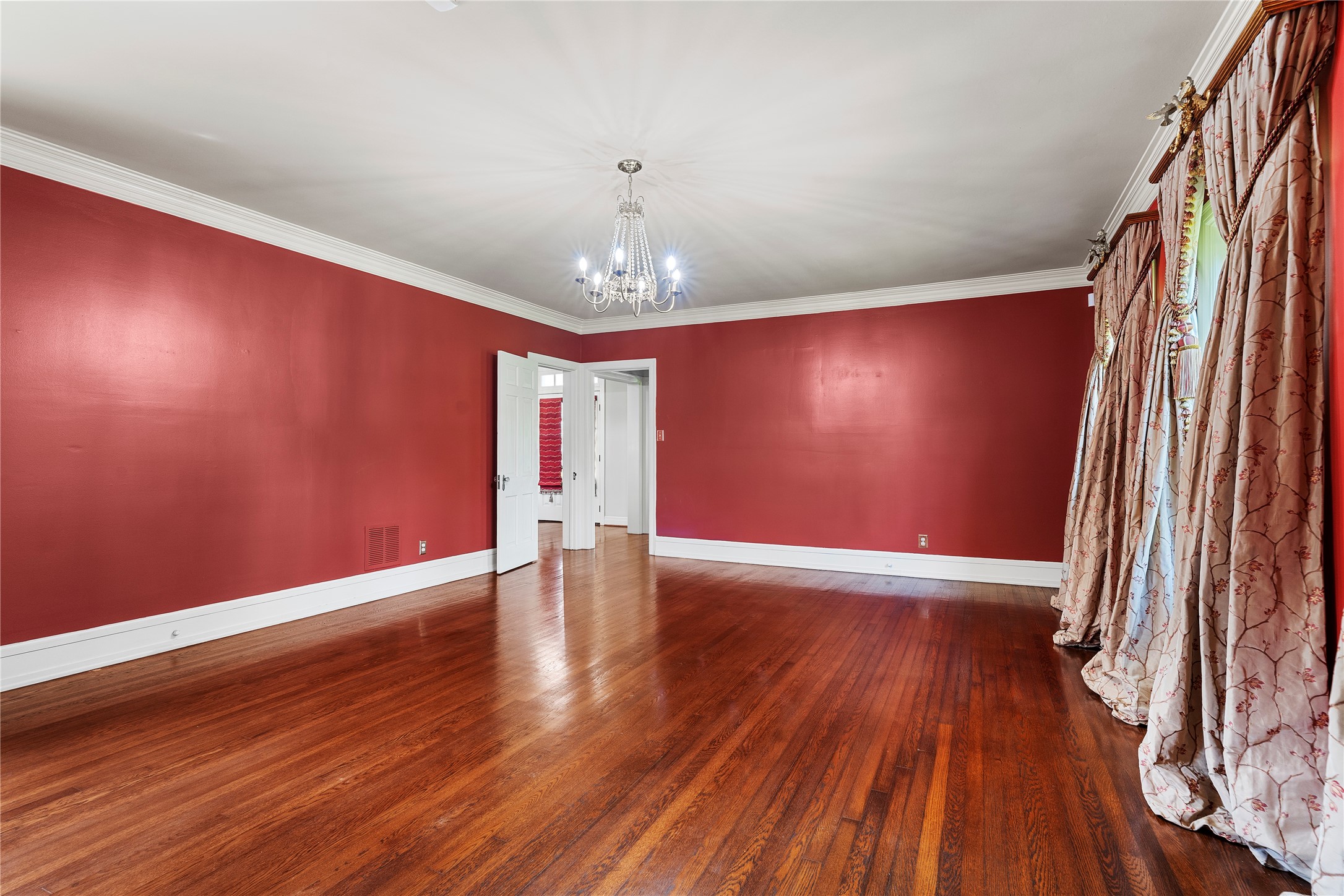 9827 FM 2759 Road Richmond, TX 77469 - Photo 14 of 50 a view of an empty room with wooden floor and a window