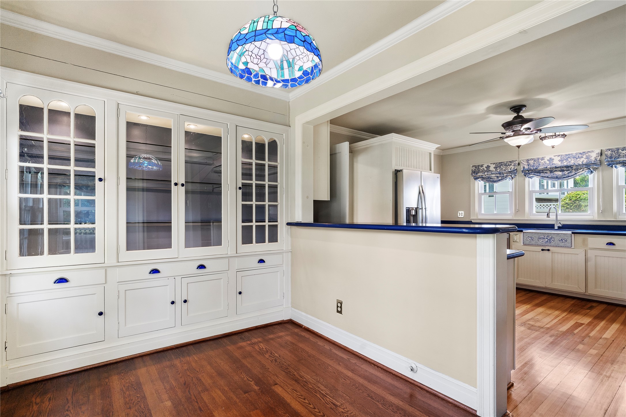 9827 FM 2759 Road Richmond, TX 77469 - Photo 15 of 50 a view of an empty room with chandelier fan and wooden floor