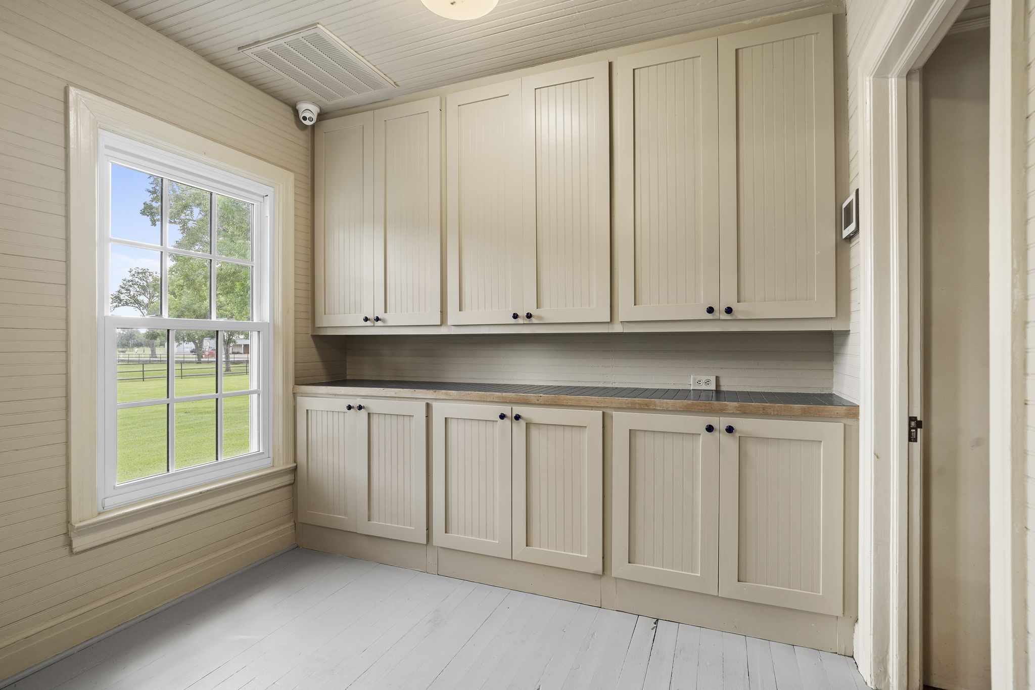 9827 FM 2759 Road Richmond, TX 77469 - Photo 21 of 50 a view of a kitchen with white cabinets