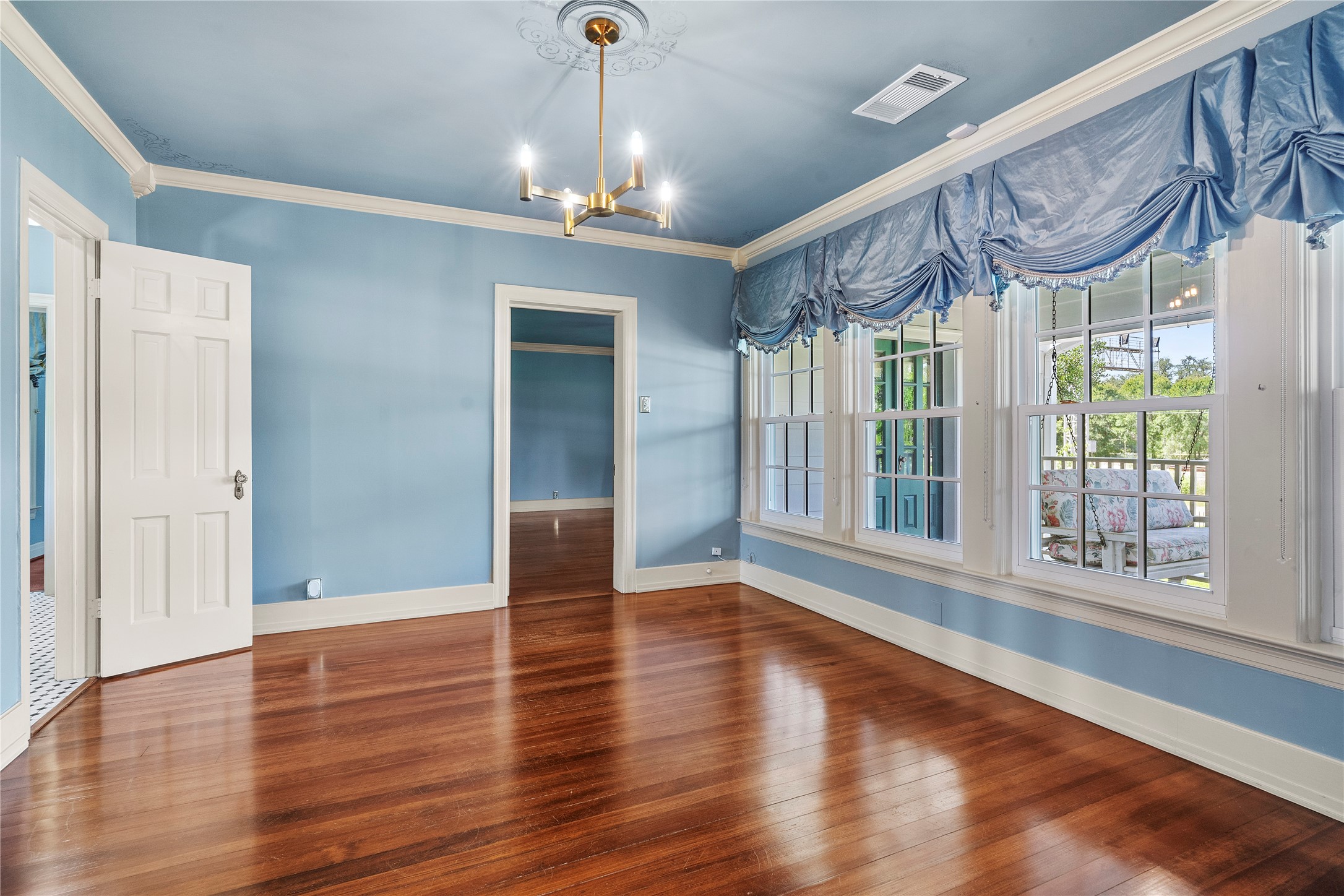 9827 FM 2759 Road Richmond, TX 77469 - Photo 29 of 50 a view of an empty room with wooden floor and a window