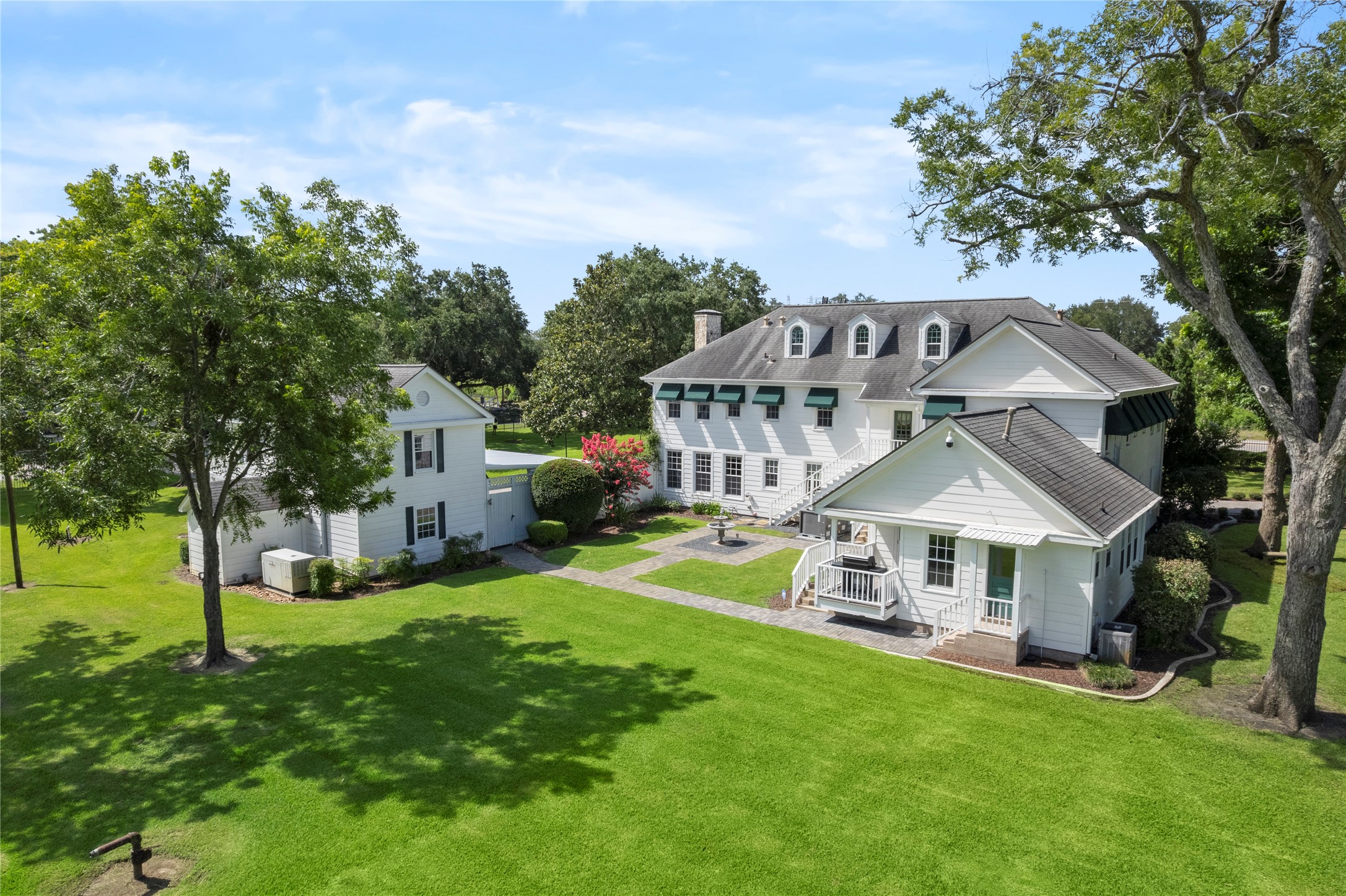 9827 FM 2759 Road Richmond, TX 77469 - Photo 43 of 50 a view of a house with a big yard plants and large trees