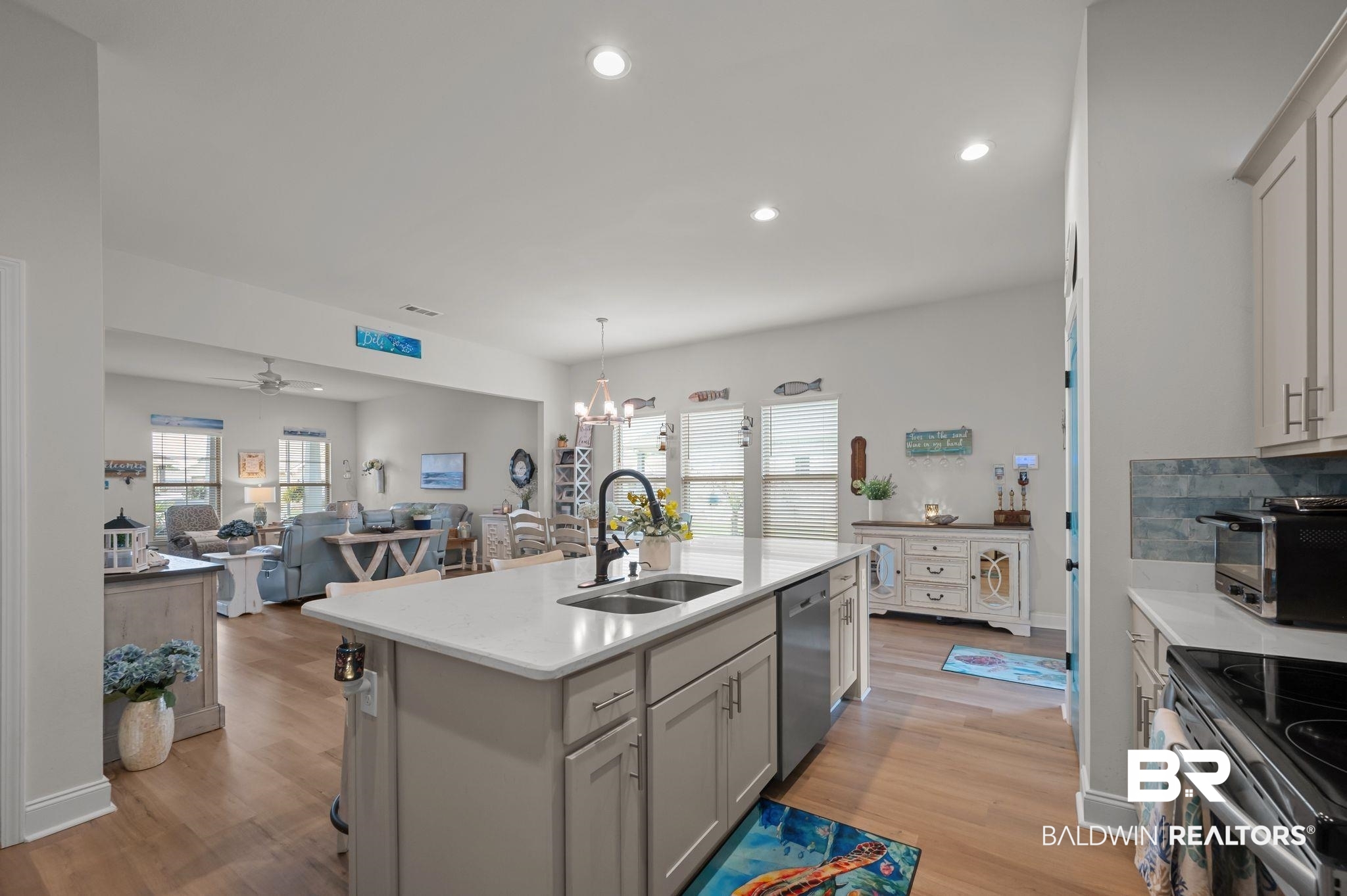 1165 Stella Road Foley, AL 36535 - Photo 15 of 42 Kitchen featuring a sink, dishwasher, light countertops, light wood finished floors, and recessed lighting