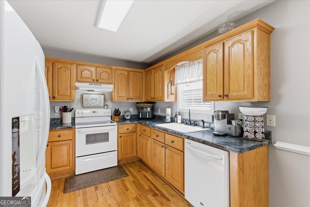 1111 Old Collard Valley Road Aragon, GA 30104 - Photo 14 of 38 a kitchen with a sink cabinets and window