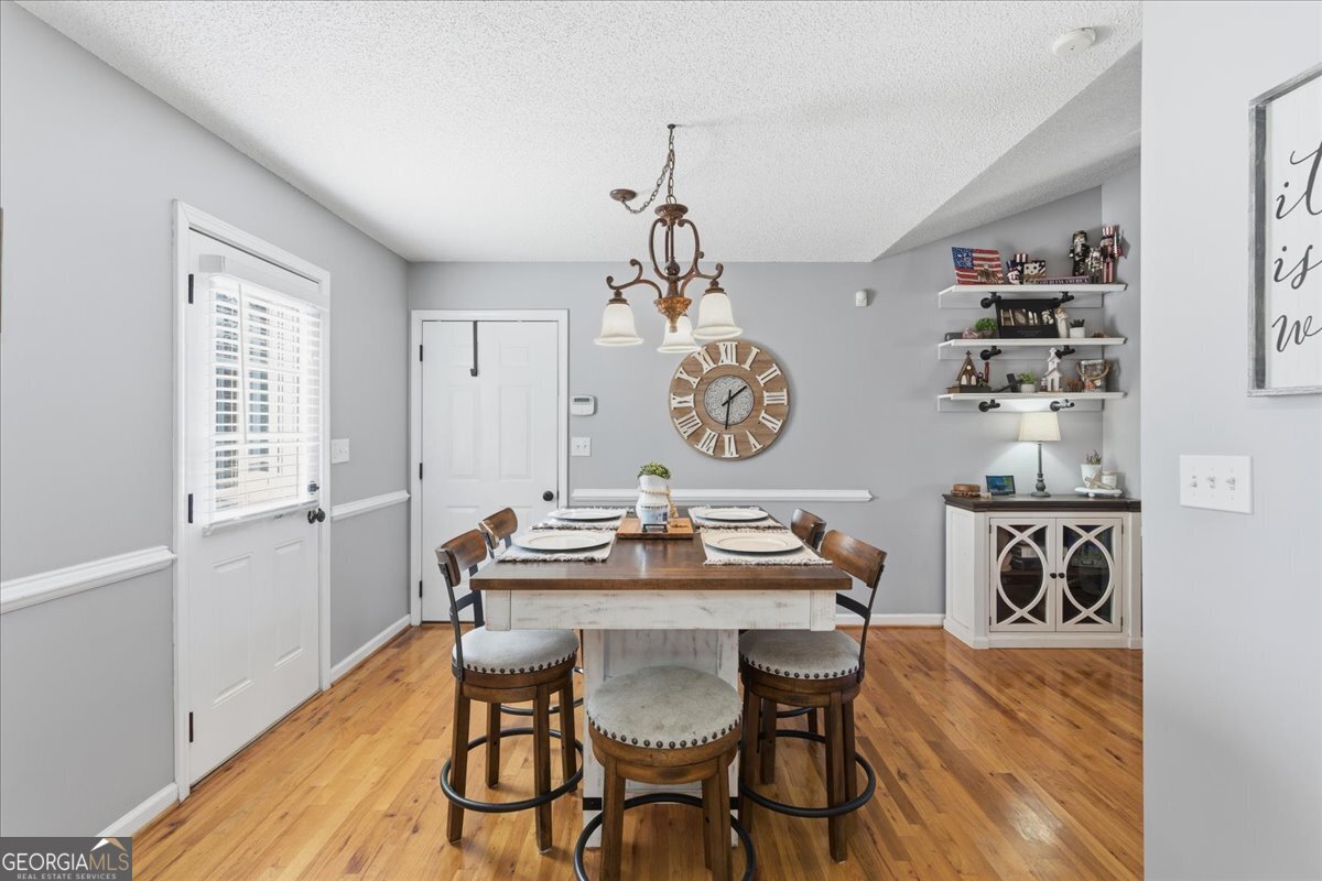 1111 Old Collard Valley Road Aragon, GA 30104 - Photo 17 of 38 a view of a dining room with furniture and wooden floor